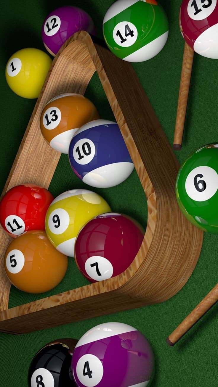 Glossy pool balls spilling from a wooden triangle rack